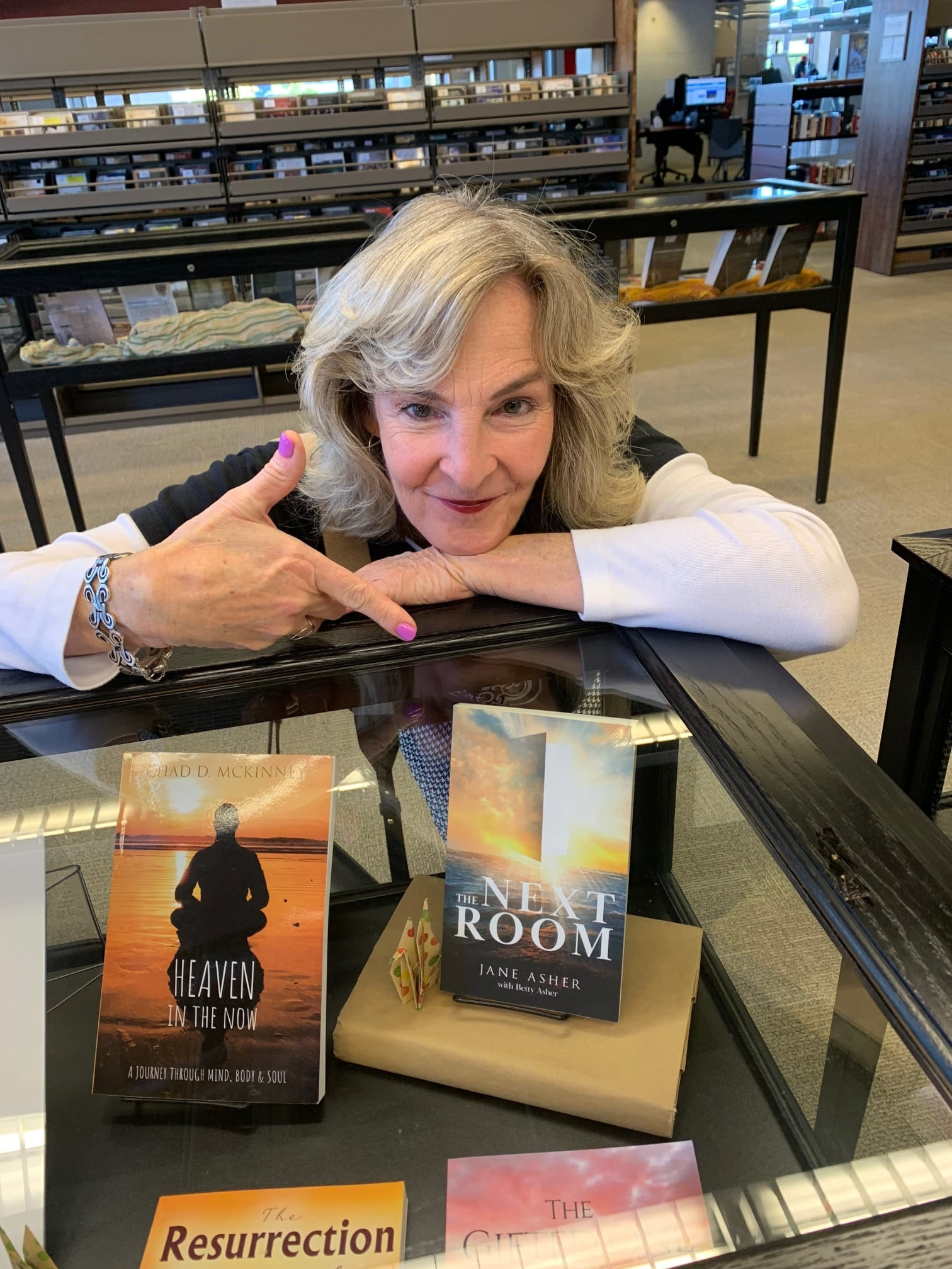 Jane Asher Reaney with her publiched book, The Next Room